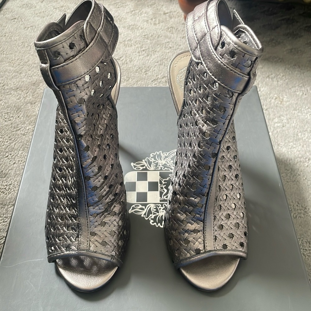 Silver open toe heels.